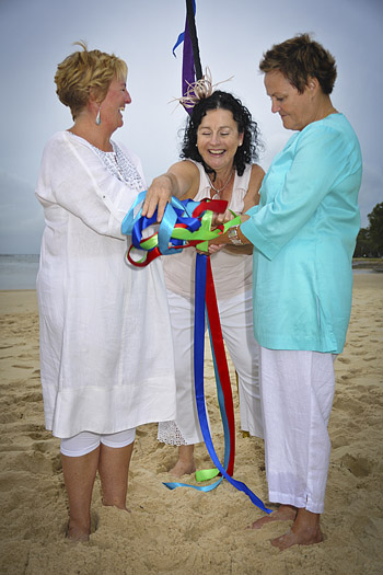 Rainbow Pride Celebrant Marilyn Verschuure conducted Jude & Barb's Handfasting Commitment on Bribie Island's legendary Pumicstone Passage Beach